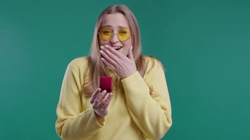 Delighted Woman Receiving a Gift in a Jewelry Box