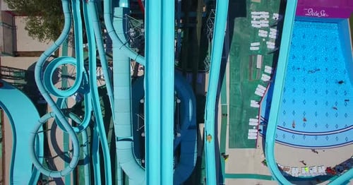 Aerial view of people sliding down a water slide at a water park