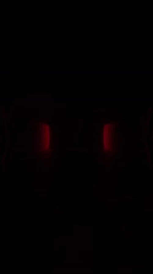 Explore a dark tunnel illuminated by a mysterious red light emanating from within.