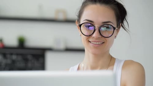Cute 30s Lady Working at Desk in Trendy Hipster Startup Office Using