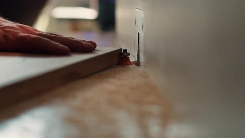 Cabinetmaker in Joinery Using Heavy Machinery Close Up