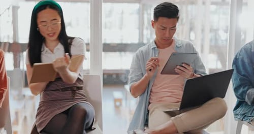 Young Adults Working Together in Modern Workplace