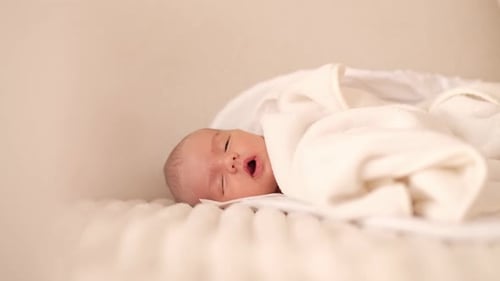 Peaceful Newborn Baby Sleeping Soundly in Crib
