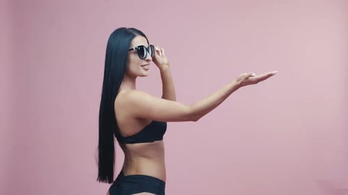 Beautiful Woman Posing in Bikini and Sunglasses