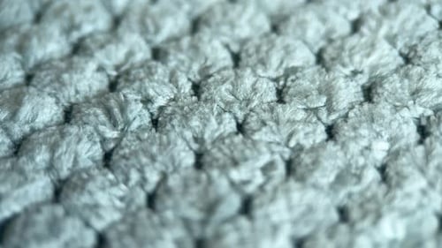 Abstract Light Gray Knit Textile Close-Up