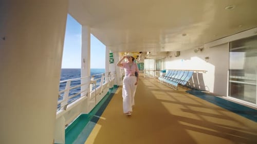 A Stylish Woman Relishes the Delightful Cruise Experience at Sea