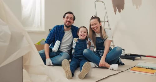 Joyful Family Painting Room Together