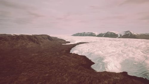A Majestic Glacier Surrounded By Towering Mountains