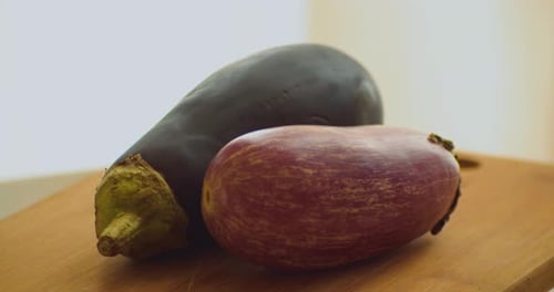 Eggplant Close Up. Edible Fruit Spinning on Plate in the Kitchen