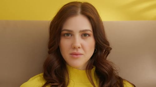 Young Woman Smiling Gently At The Camera