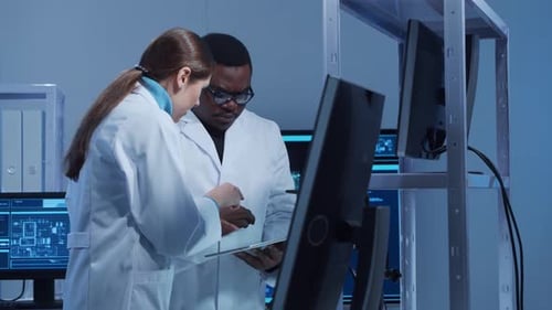 Scientists Discussing Data in a Research Lab