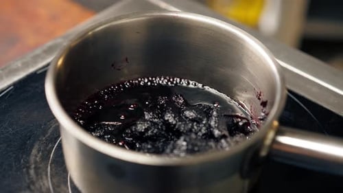 Blueberry Sauce Simmering in Pot on Stove
