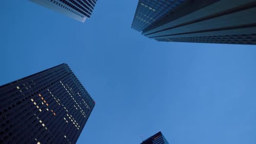 Low Angle Spinning Shot of Skyscrapers in the Tokyo. Financial District. Skyscape and Cityscape in
