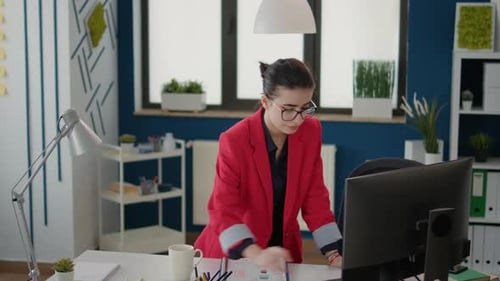 Woman Working on Computer in Modern Office