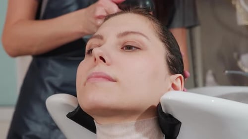 Woman Getting Hair Washed at the Hair Salon