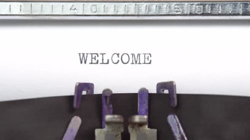 Typewriter Types the Word Welcome in Close Up