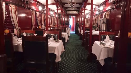 Interior fine dining establishment on a luxury train.