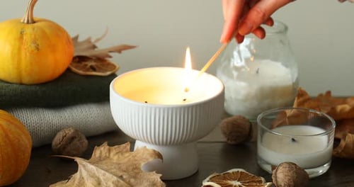 Fall Decor with Pumpkins, Candles, and Autumn Leaves