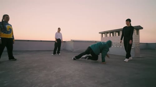 Youthful Group Dancing at Sunrise in the City