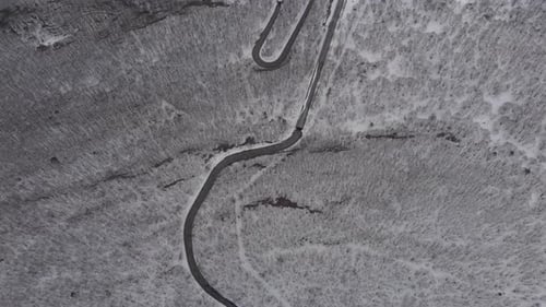 Aerial Drone View of Winding Road through Snowed landscape on Mount Zaō Japan