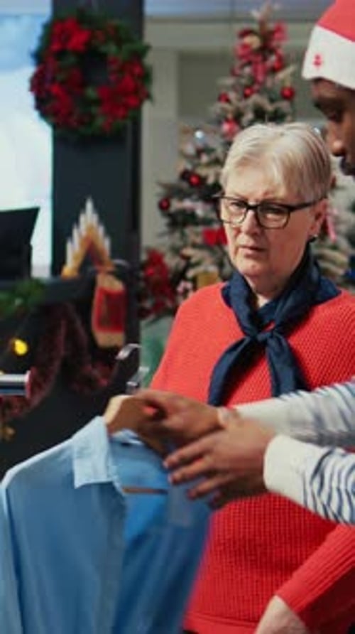 Vertical Video Employee Assisting Older Client in Store