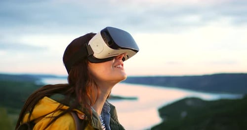 Young Woman Wearing VR Headset with River View