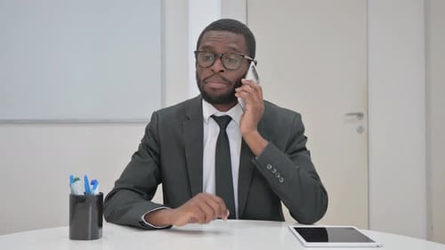 Talking Businessman Engaged in a Phone Call