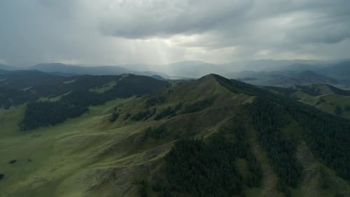 Aerial Panoramic View of Green Hills with Trees on an Overcasted Day in Highlads of Altai Region