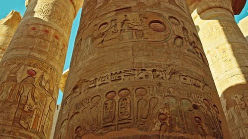 Close Up View of Detailed Hieroglyphs and Carved Reliefs on Massive Sandstone Columns Inside the
