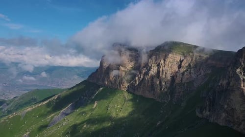 Aerial View of Mountain Landscape Under Cloudy Sky Showing Breathtaking Highland Terrain
