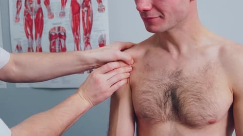 Physiotherapist Tells a Man About the Risk of Injury Due to Hard Physical Work