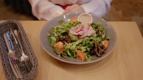 Salad Plate with Green Vegetables and Sliced Tomatoes