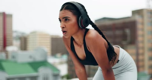 Fitness, headphones and woman breathe in city for training, running and exercise outdoors