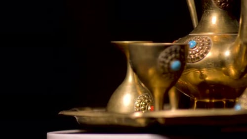 Ornate Golden Tea Set with Decorative Stones