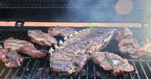 BBQ Grill is Used to Hot Smoke a Variety of Juicy Pork Meats