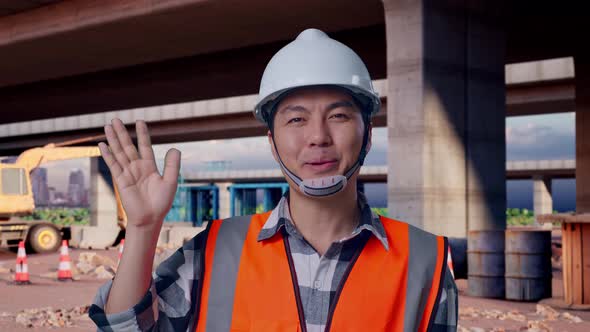 Close Up Of Male Engineer Smiling To Camera And Waving Hand Saying Bye ...