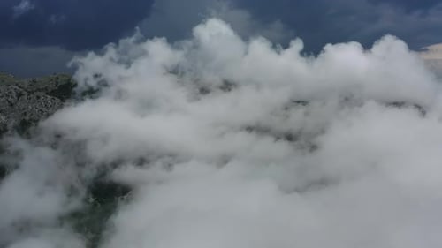Aerial View of Clouds and Mountains