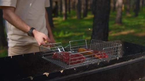 Close-up of hot juicy red meat on grill