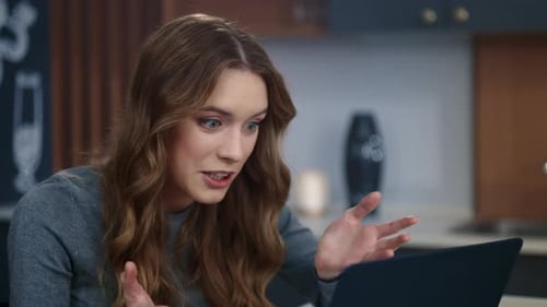 Woman Video Calling and Chatting on Laptop