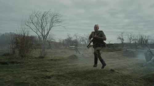 Group Of Soldiers Running Along Battleground