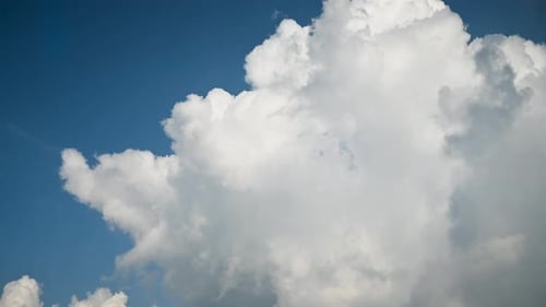 Dramatic White Clouds Against Blue Sky