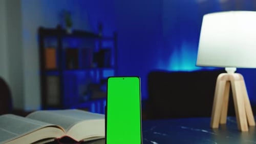 Vertical Phone with Green Screen on Table