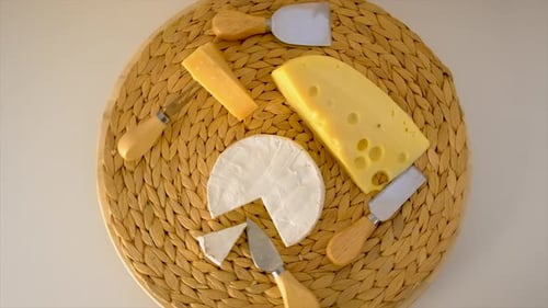 Arrangement of cheese on a decorative mat
