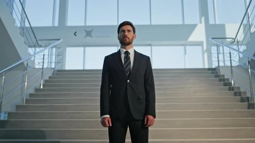 Serious Executive Standing Confidently in Office Interior Closeup Businessman