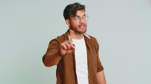 Young Adult Talking and Gesturing at the Camera