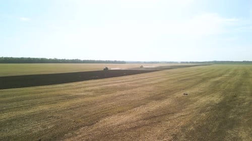 Tractors plowing the field in Ukraine