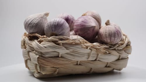 Basket of Fresh Purple Striped Garlic Bulbs