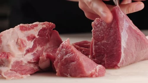 Chef Butcher Cutting Pork Meat with Knife on Kitchen Cooking Mexican Traditional Food Man Cut Big