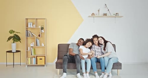 Affectionate Family Relaxing Together on Couch