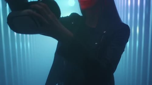 Cute Girl Puts a Virtual Reality Headset or Helmet on Her Eyes Enjoys the Experience